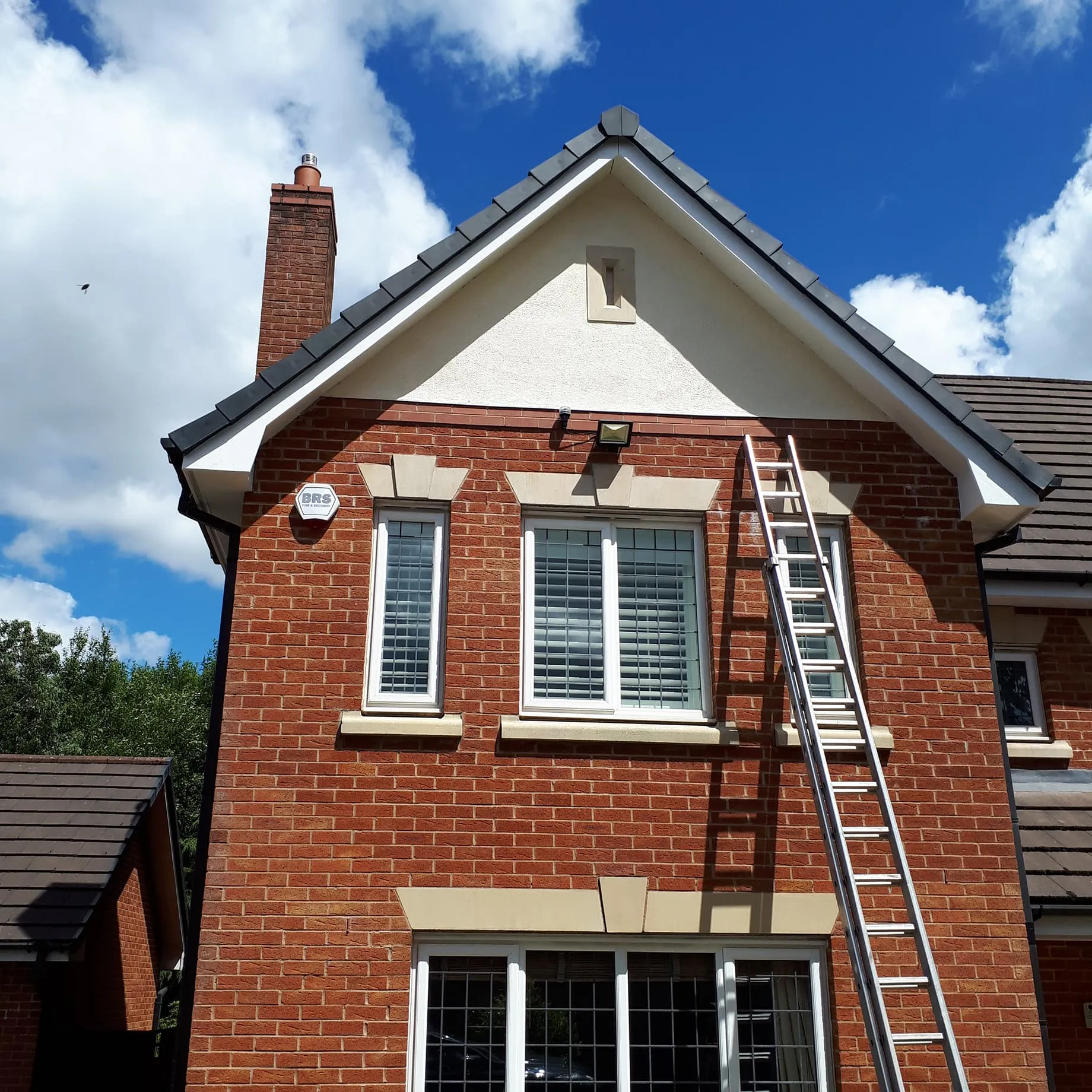 Exterior painting by Blue Hawk Roofing